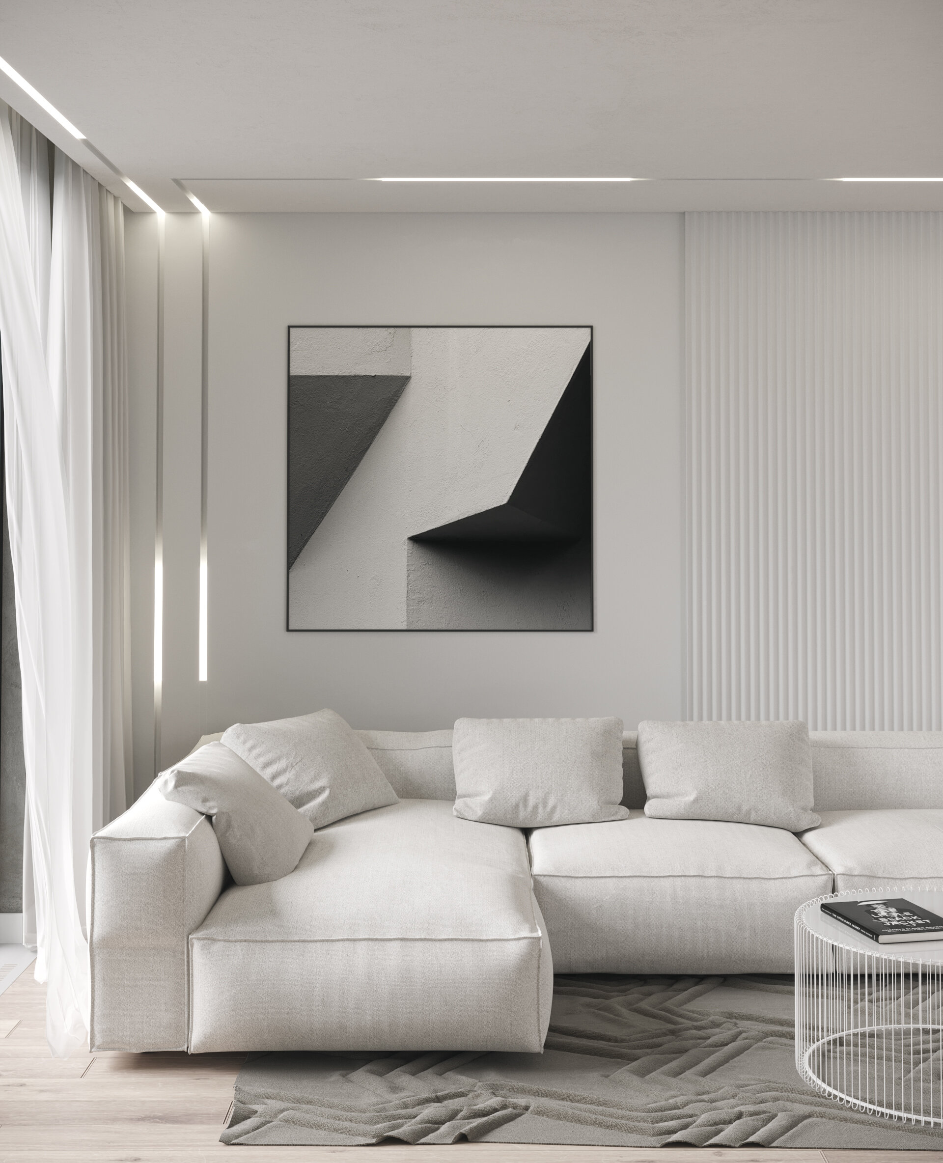 Light grey living room with a white sectional sofa, a black and white abstract artwork, a ribbed white wall panel, linear ceiling lights and sheer curtains