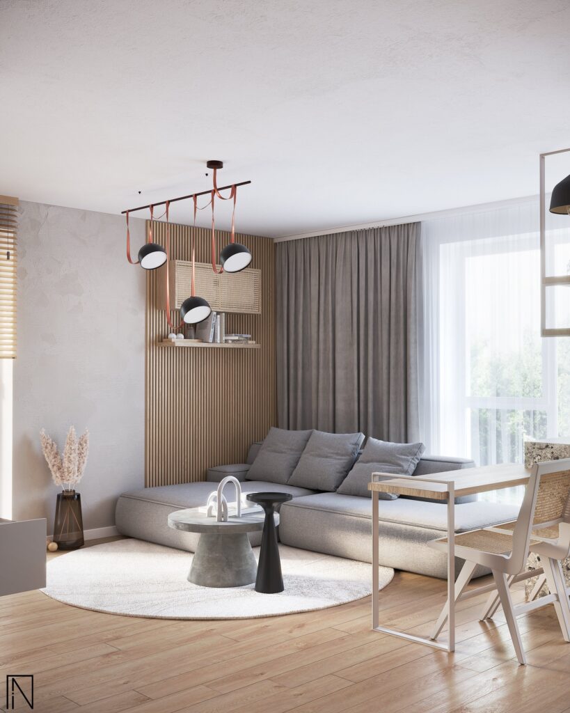 Colț de living: canapea gri lângă un panou cu lamele verticale de stejar, draperii gri, covor rotund și o masă mică cu scaune din răchită