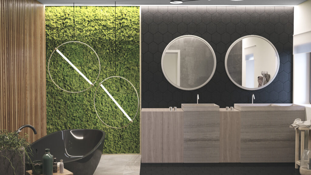 Baia văzută din față, cu perete verde de mușchi, două lustre inel, mobilier dublu sub oglinzi rotunde și cadă neagră