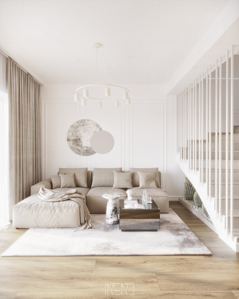Living cu canapea de colț bej, decor rotund din marmură pe perete, lustră inel și balustradă albă cu șipci la scară