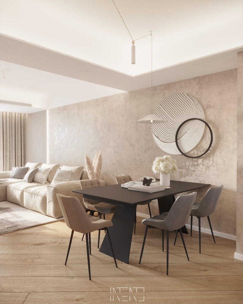 Masă de dining neagră cu scaune gri și taupe, lustră albă suspendată și tablou rotund sculptat pe peretele bej