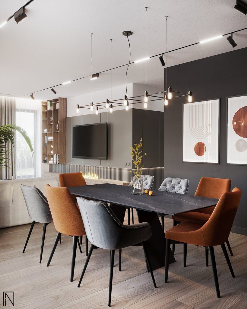 Masă de dining din piatră închisă cu scaune ruginii și gri, lustră liniară, tablouri abstracte pe perete antracit și peretele TV în spate